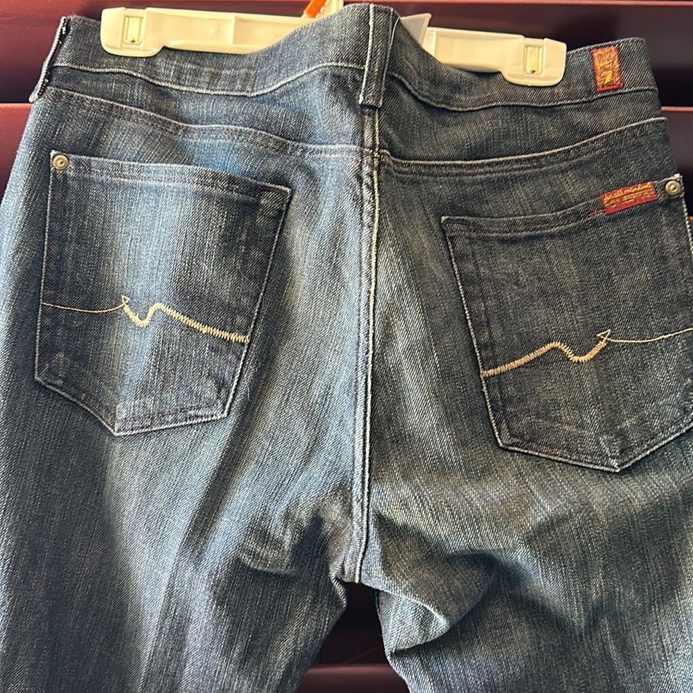 New 7 for all mankind jeans. Beautiful dark blue distressed color